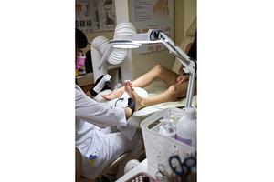 Pink toenail polish pedicure with UV
