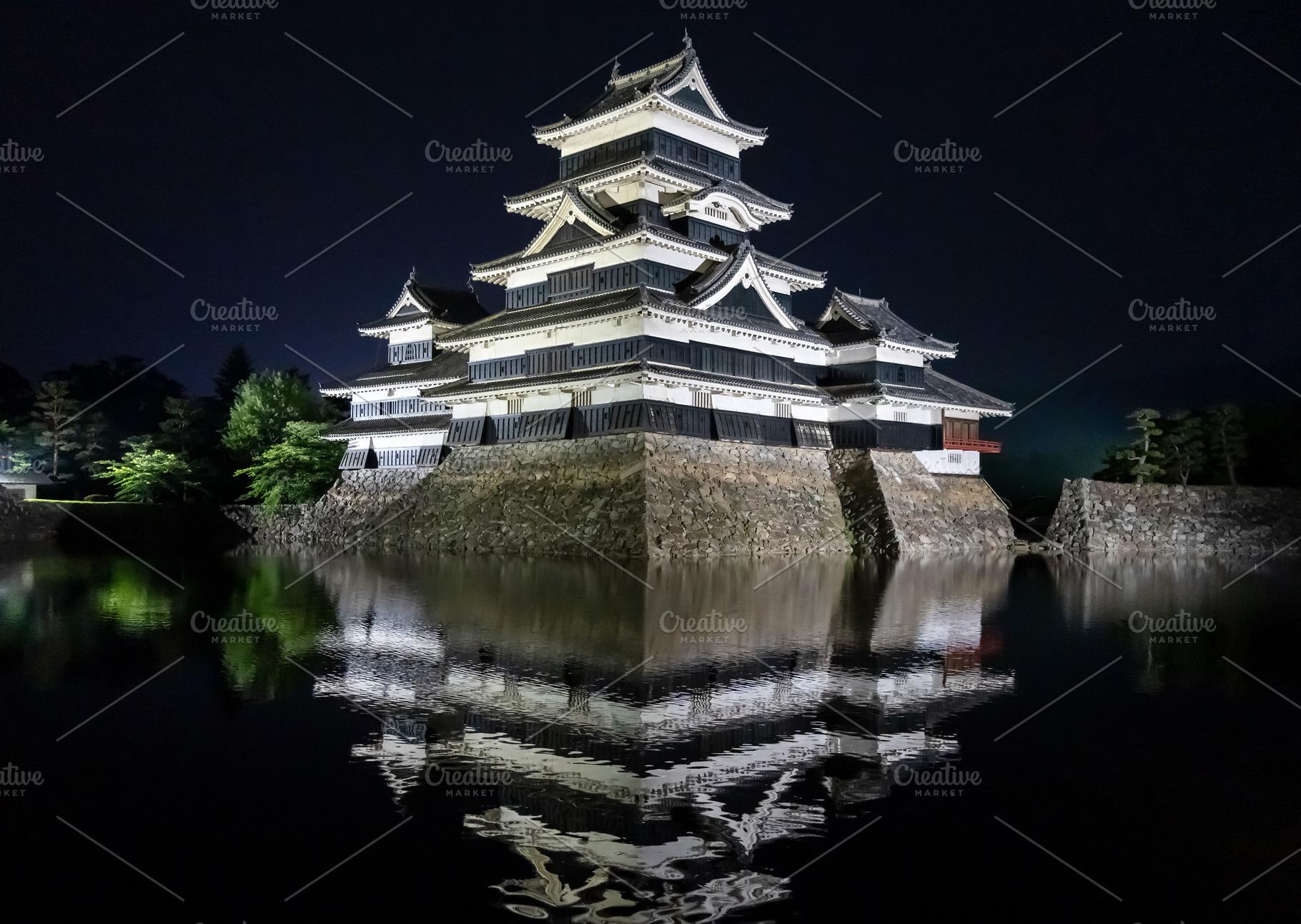 Night view of Matsumoto Castle reflecting in the water, Japan, an Architecture Photo by GoodGoods