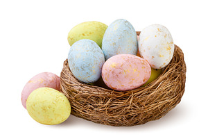 Colorful Easter eggs in a nest close, a Holiday Photo by innakreativ