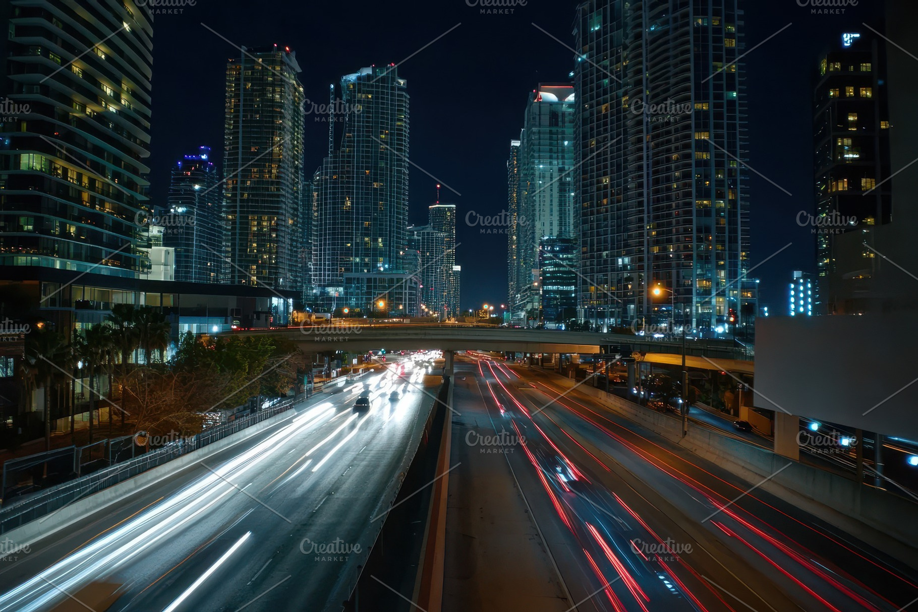 Nighttime traffic flows over a bridg, a Photo by Iftikhar Alam