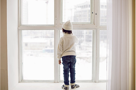 boy in a white sweater and hat, a Person Photo by SaulichPhoto