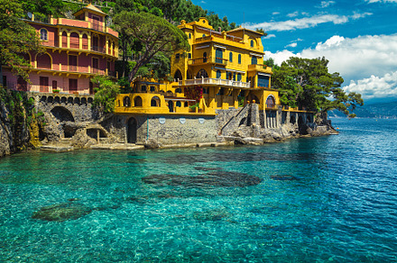 Colorful waterfront houses in Italy, an Architecture Photo by Alpine Dreams
