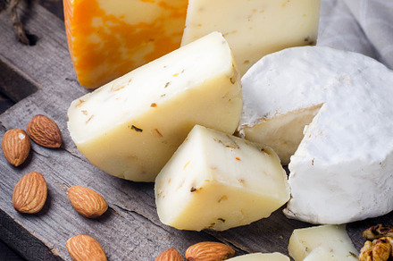 Assorted cheese pieces, vegetables, honey, fruits, cookies and n, a Food & Drink Photo by vimart