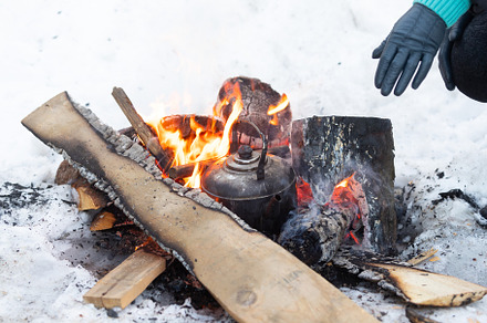 Kettle boils on fire campfire containing outdoor, fire, and campfire, a Nature Photo by oleghz