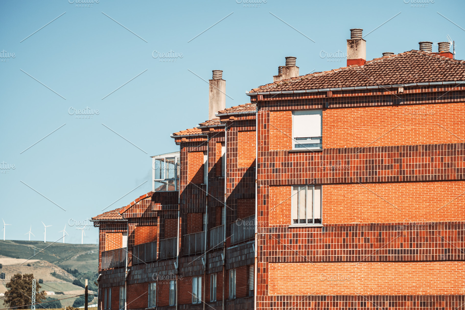 Brick apartment with wind turbines, an Architecture Photo by SkyNext