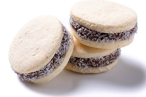 Traditional alfajores filled with dulce de leche and coconut, a Food & Drink Photo by etorres69