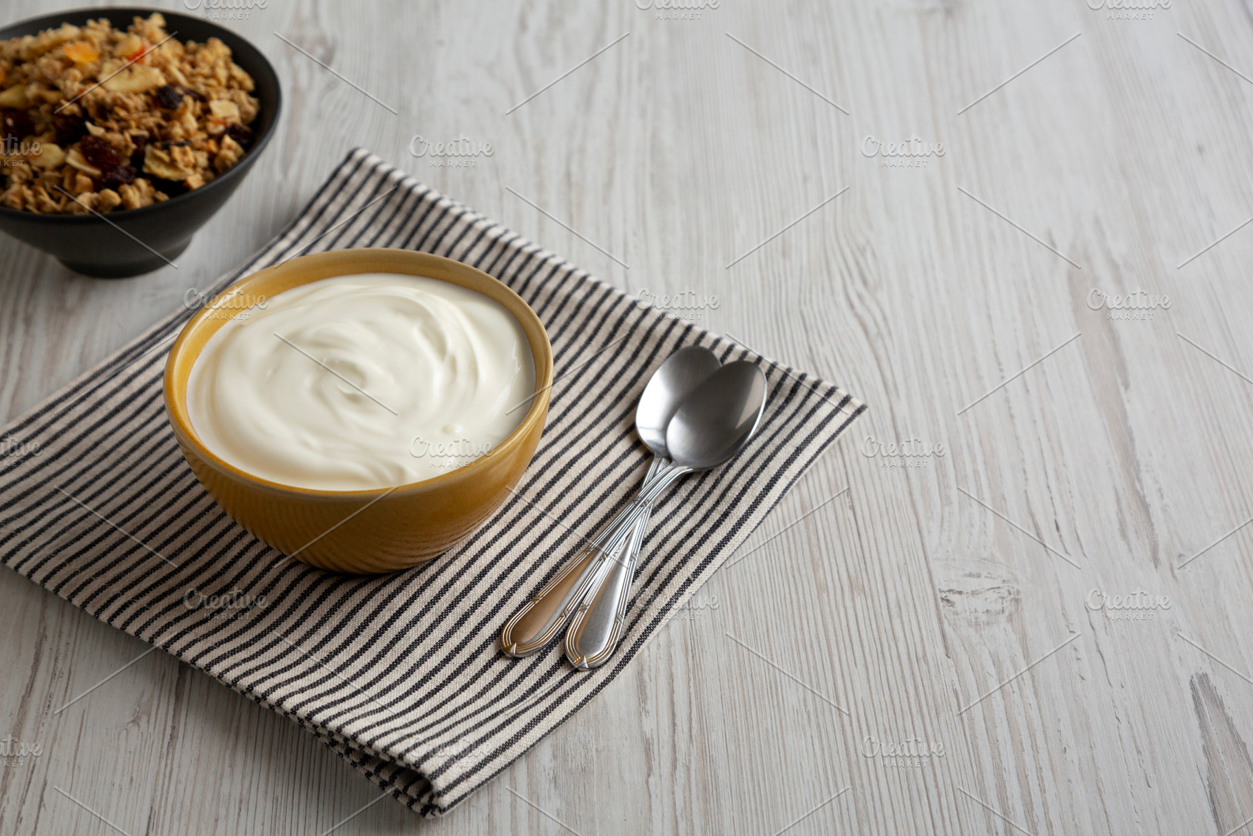 Organic Whole Fat Greek Yogurt in a Bowl, side view. Copy space., a Food & Drink Photo by LiudmylaChuhunova