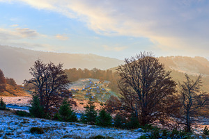 Autumn morning mountain panoramic view with sunbeams through haz, a Nature Photo by YuriyB