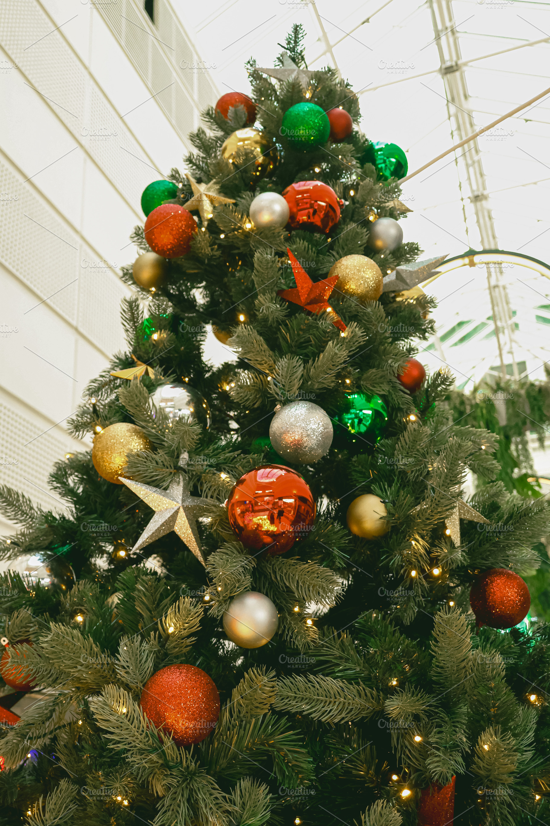Christmas tree decorating home for winter holiday celebration, hanging red, gol, a Photo by Studio ANNA