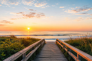 Sunset at the beach with wooden path, a Photo by Beautiful things
