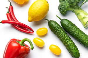Colorful fresh vegetables and fruits forming healthy food mosaic, a Food & Drink Photo by Olena Rudo