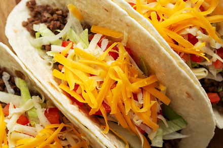 Homemade American Beef Tacos with lettuce, tomato and cheese on, a Food & Drink Photo by LiudmylaChuhunova