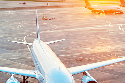 Modern airport overlooking featuring airplane, airport, and sunset, a Transportation Photo by joyt
