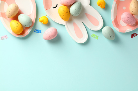 Happy Easter flat lay composition. Frame border made of colorful Easter eggs an, a Holiday Photo by photoguns