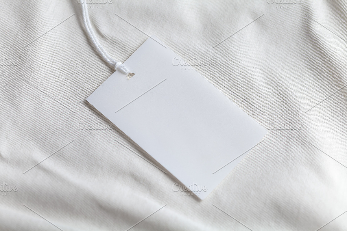 Clothes label tag blank white mockup, an Advertising Mockup by Olha Klein (Photo 2 of 3)