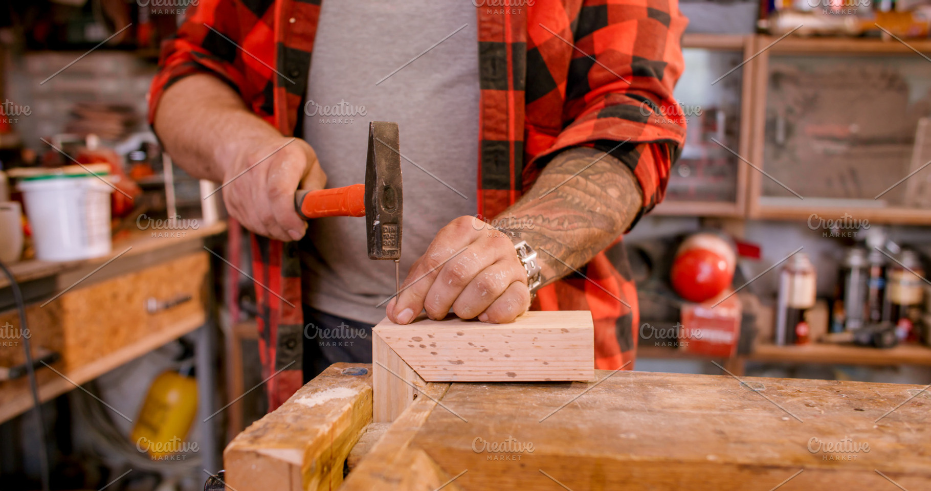 Carpentry workflow hammering nail, a Person Photo by Photo Drive Studio