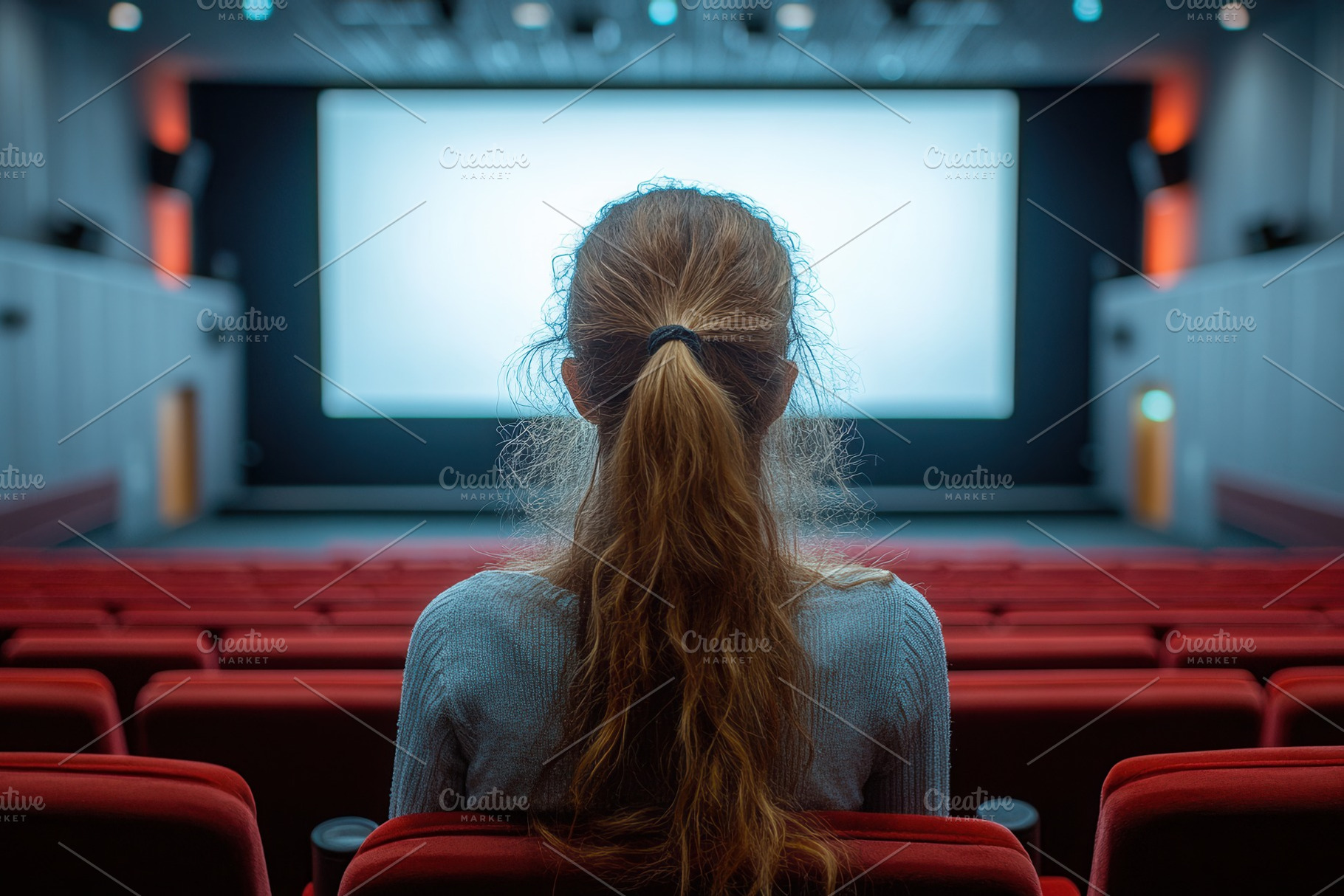 Watching a movie in a nearly empty t, a Photo by Tanuart