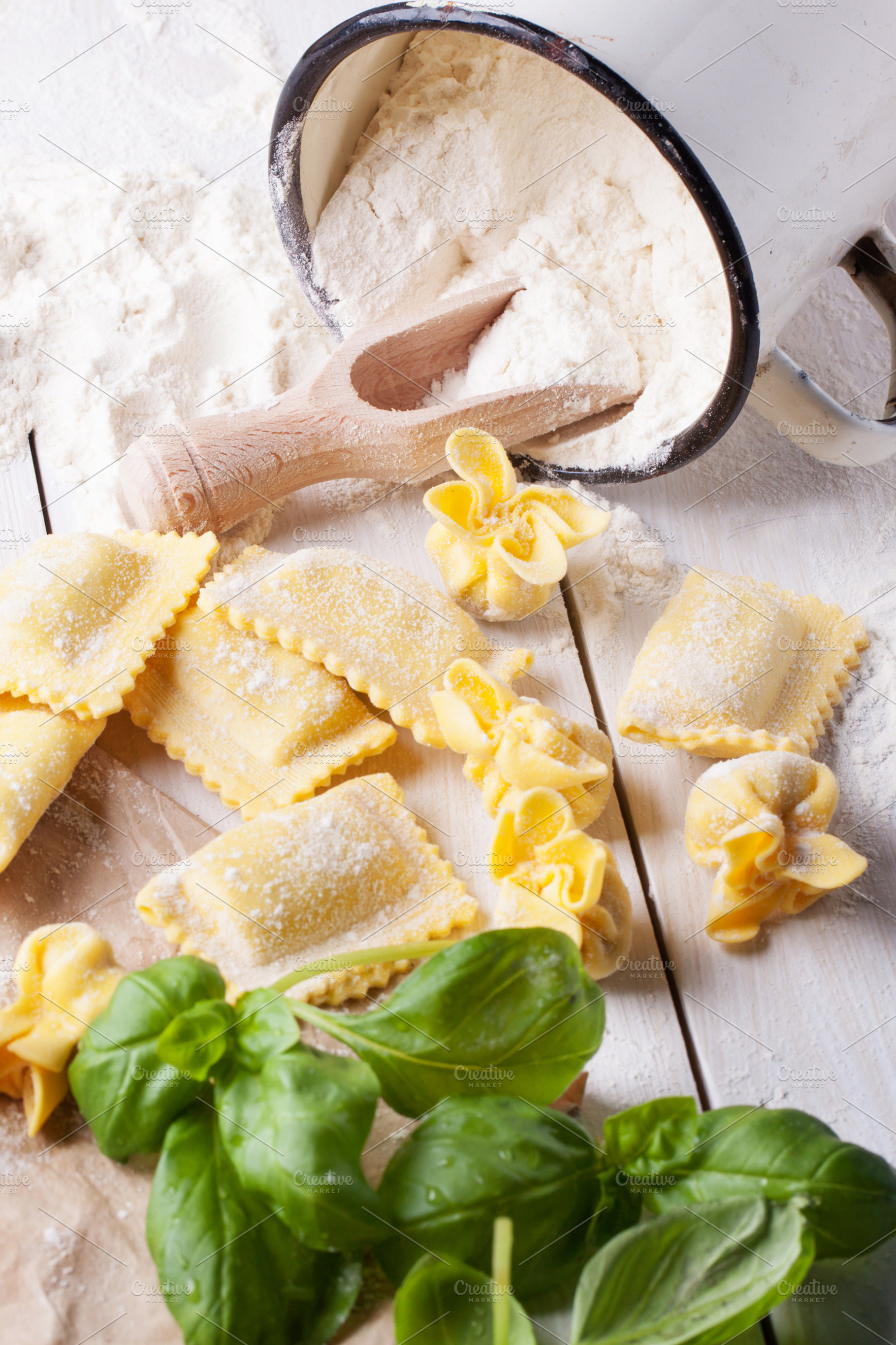 Pasta ravioli on flour with basil featuring pasta, ravioli, and italian