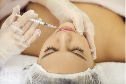 Young woman getting botox injection, a Health & Medical Photo by StudioRomantic