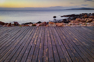 Boardwalk leading to the sea at sunset, piriapolis, uruguay, a Nature Photo by DanFLCreativo