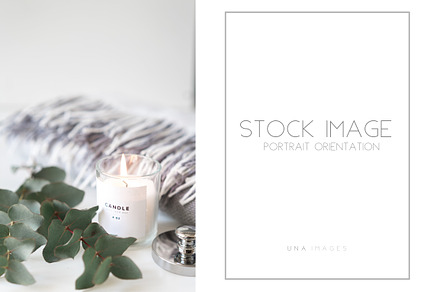 Burning candle with eucalyptus., a Holiday Photo by Una Matison