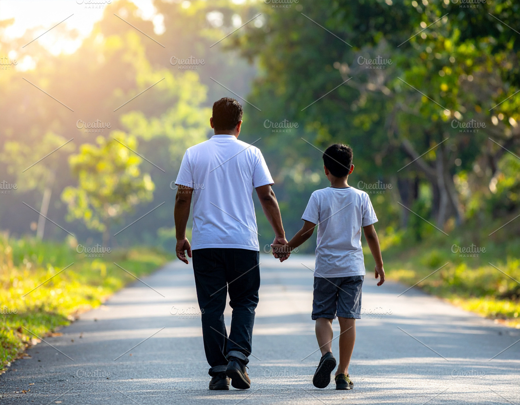 Father and his son walking in a natural outdoor setting, a Person Photo by DanFLCreativo