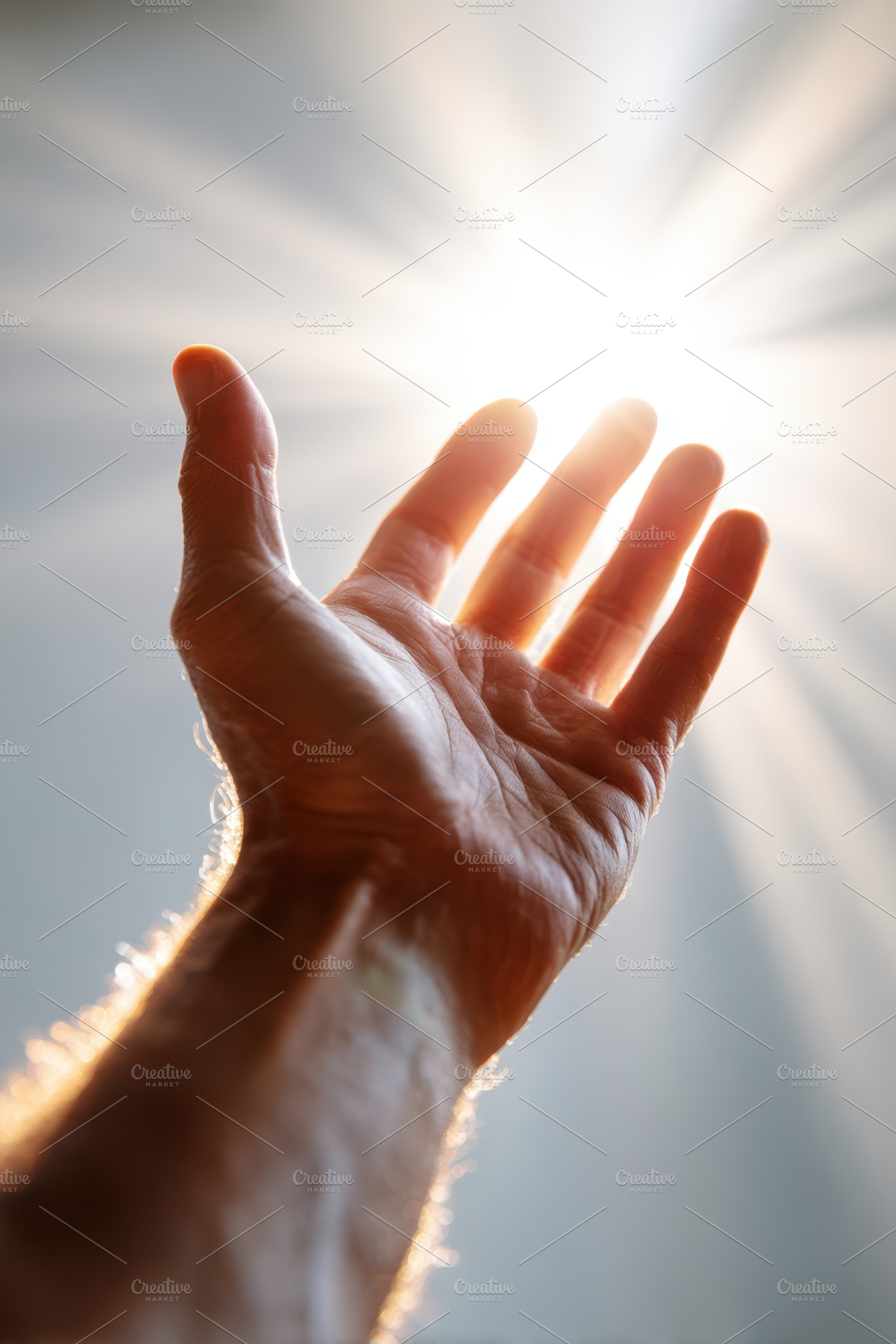 Hand reaching towards bright light, a Person Photo by AlyaAnd