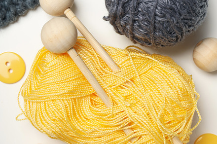 Concept of hobby, cozy and relaxing hobby, knitting, a Beauty & Fashion Photo by AtlasStudio