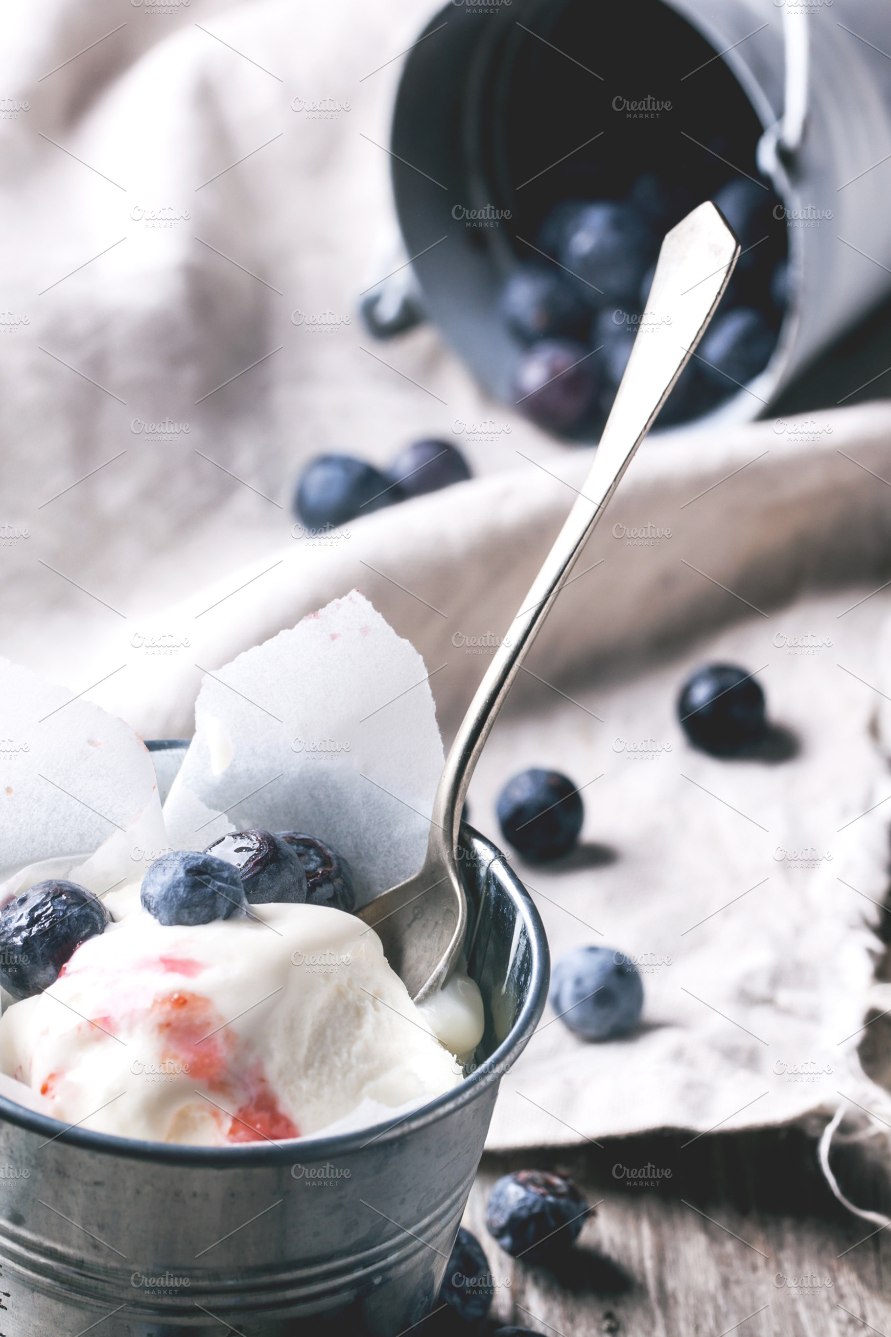 Ice cream with blueberries containing ice, cream, and frozen