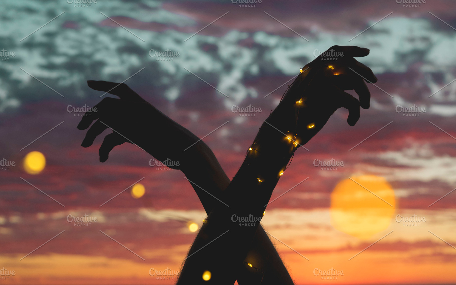 Hands with lights at sunset, a Nature Photo by Fossilized Tree Sap
