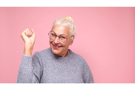 An elderly European woman in glasses