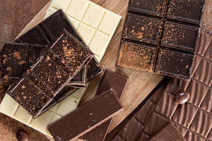 Assortment of white, milk and dark chocolate pieces, a Food & Drink Photo by etorres69