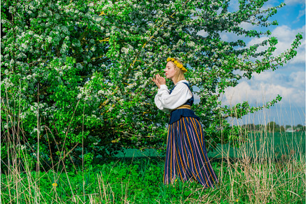 Beautiful feminime woman in national, a Holiday Photo by COLORFUL