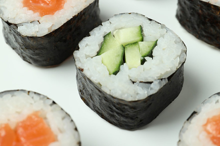 Concept of tasty food with sushi rolls on white background, a Food & Drink Photo by AtlasStudio PRO