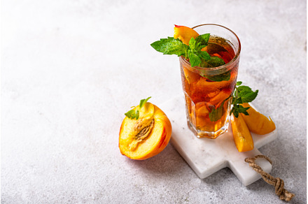 Cold ice tea with peach and mint, a Food & Drink Photo by Yulia Furman