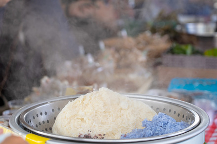 sticky rice steamed with coconut milk in silver pot, a Food & Drink Photo by Casanowe-studio