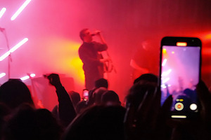 Live band on stage with radial light beams, a Sports & Recreation Photo by DanFLCreativo
