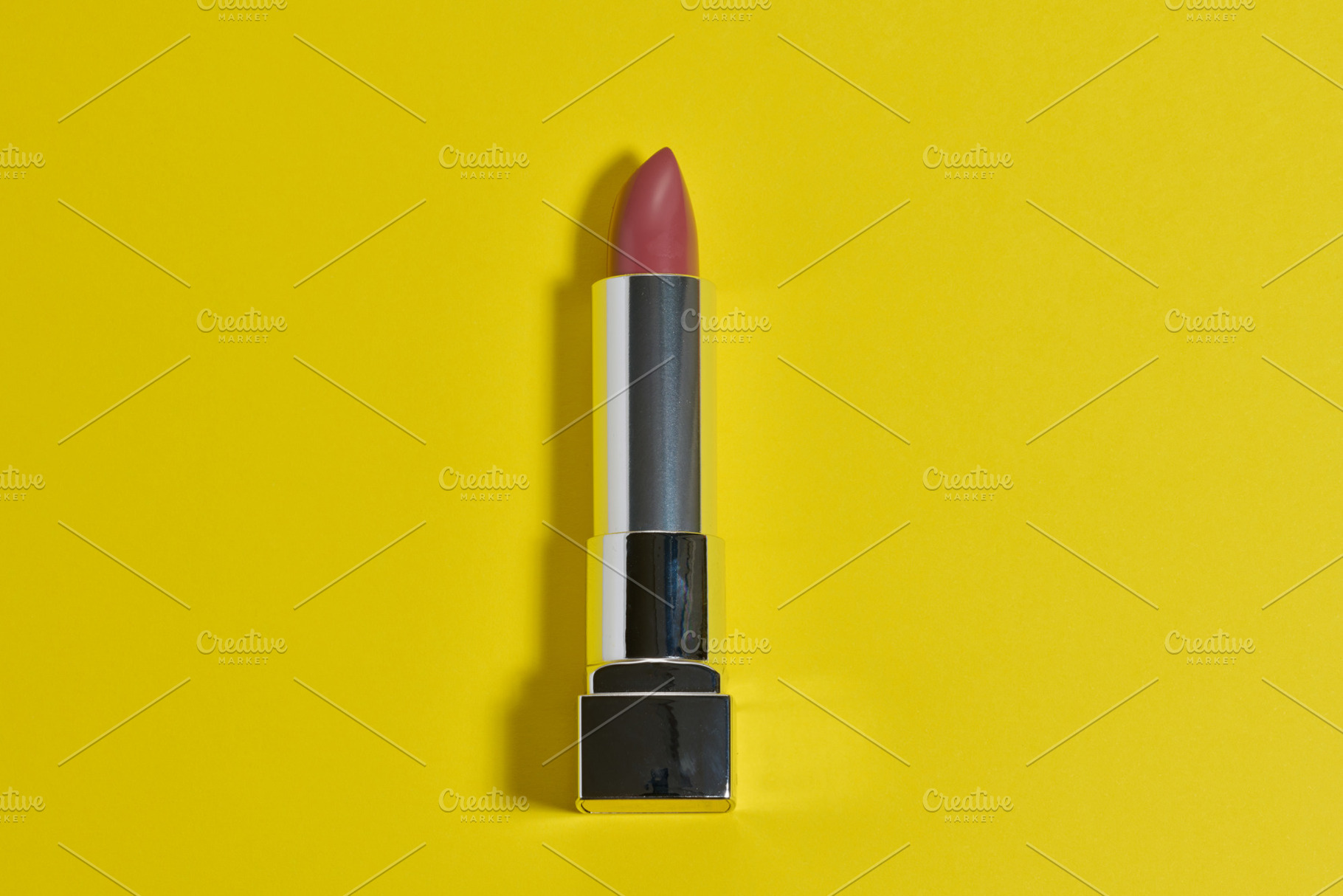 Fuchsia lipstick in a stylish metallic silver case. The lipstick, a Beauty & Fashion Photo by ndanko