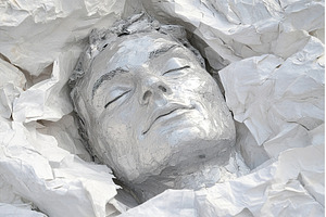 Silver Painted Human Head Enclosed, a Background Photo by Lermont51
