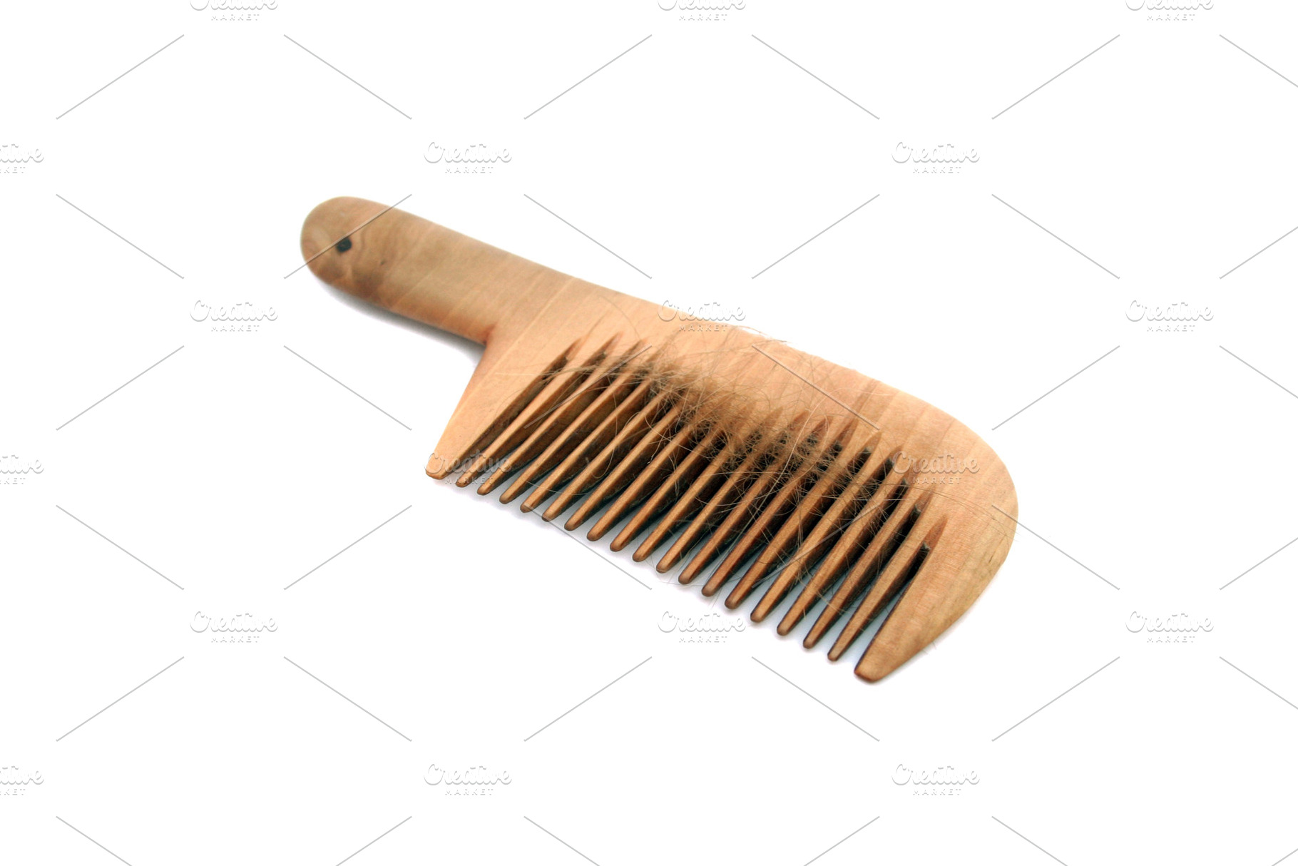 Isolated comb with loss hair, a Photo by saiko3p