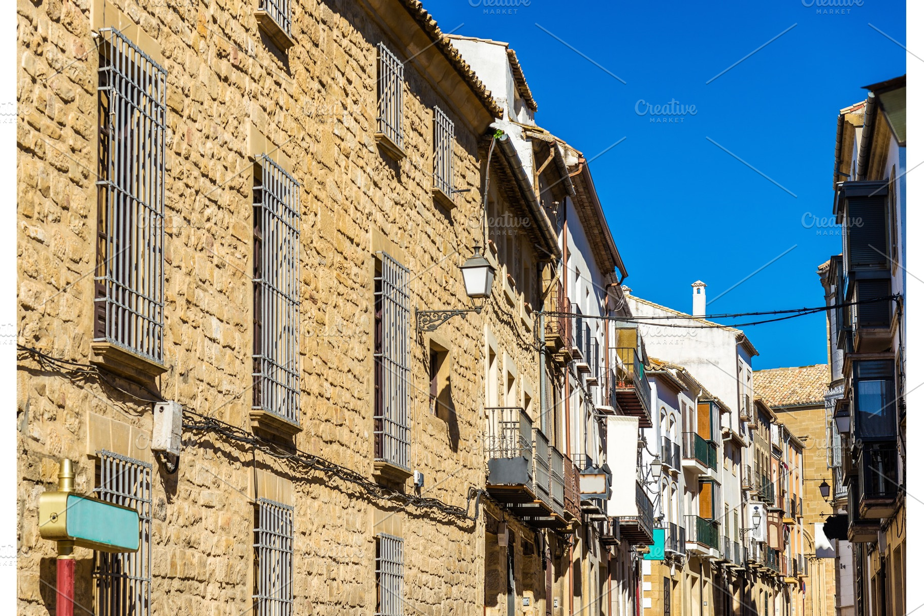 Buildings in the old town of ubeda spain featuring street, spanish, and europe, an Architecture Photo by Leonid Andronov