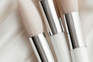 Three makeup brushes arranged, a Photo by Dvoevnore photos
