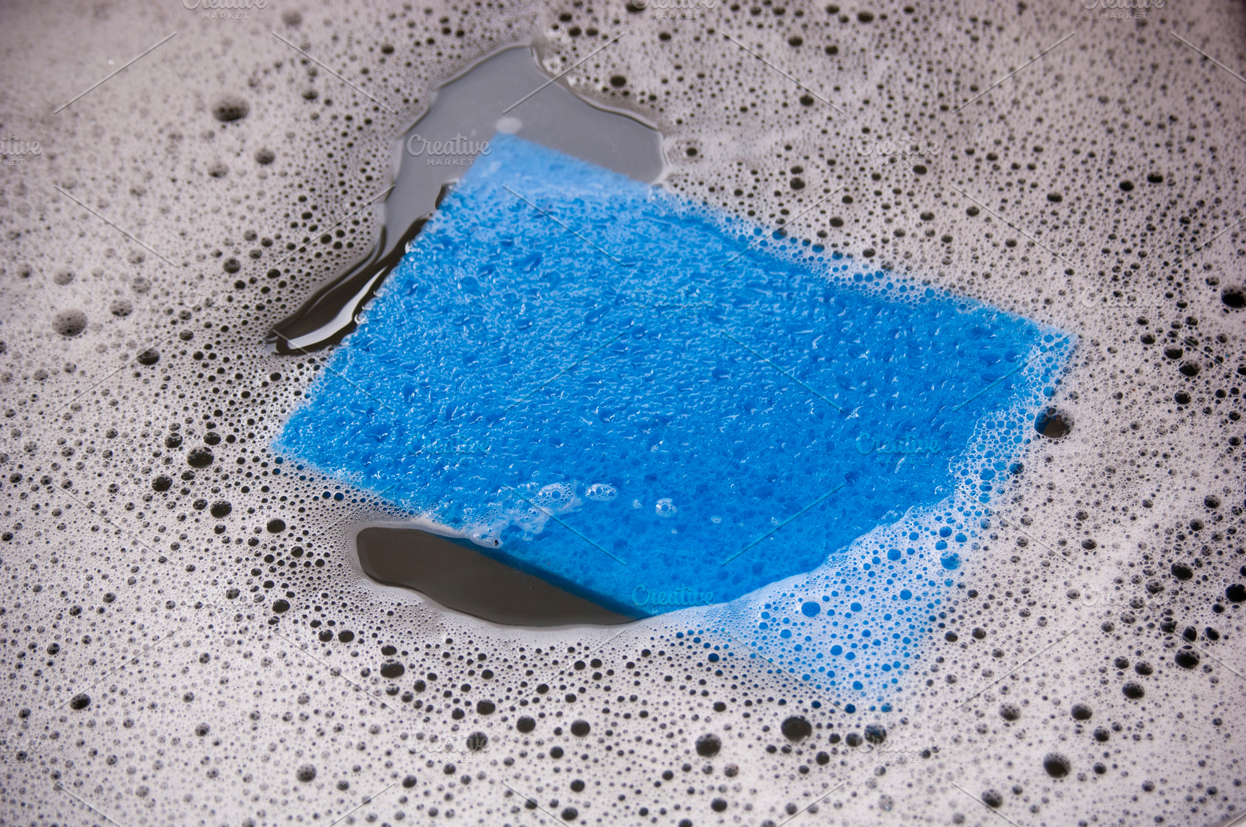 Blue Sponge In Dishwater, an Abstract Photo by THP Creative