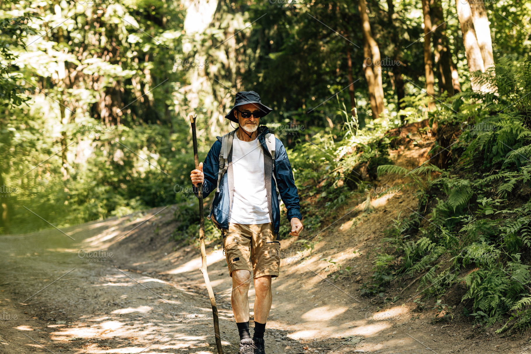 Senior male with a wooden stick, a Sports & Recreation Photo by Artem Varnitsin