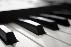 Keyboard containing piano, bokeh, and keyboard
