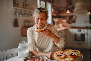 Grandmother eating homemade, a Holiday Photo by HalfPoint