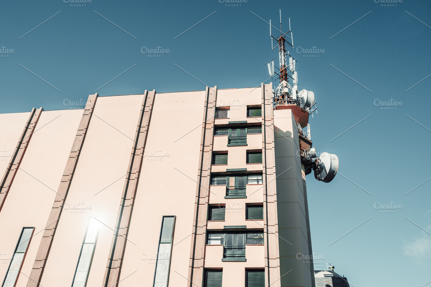 Building with rooftop antennas, an Architecture Photo by SkyNext