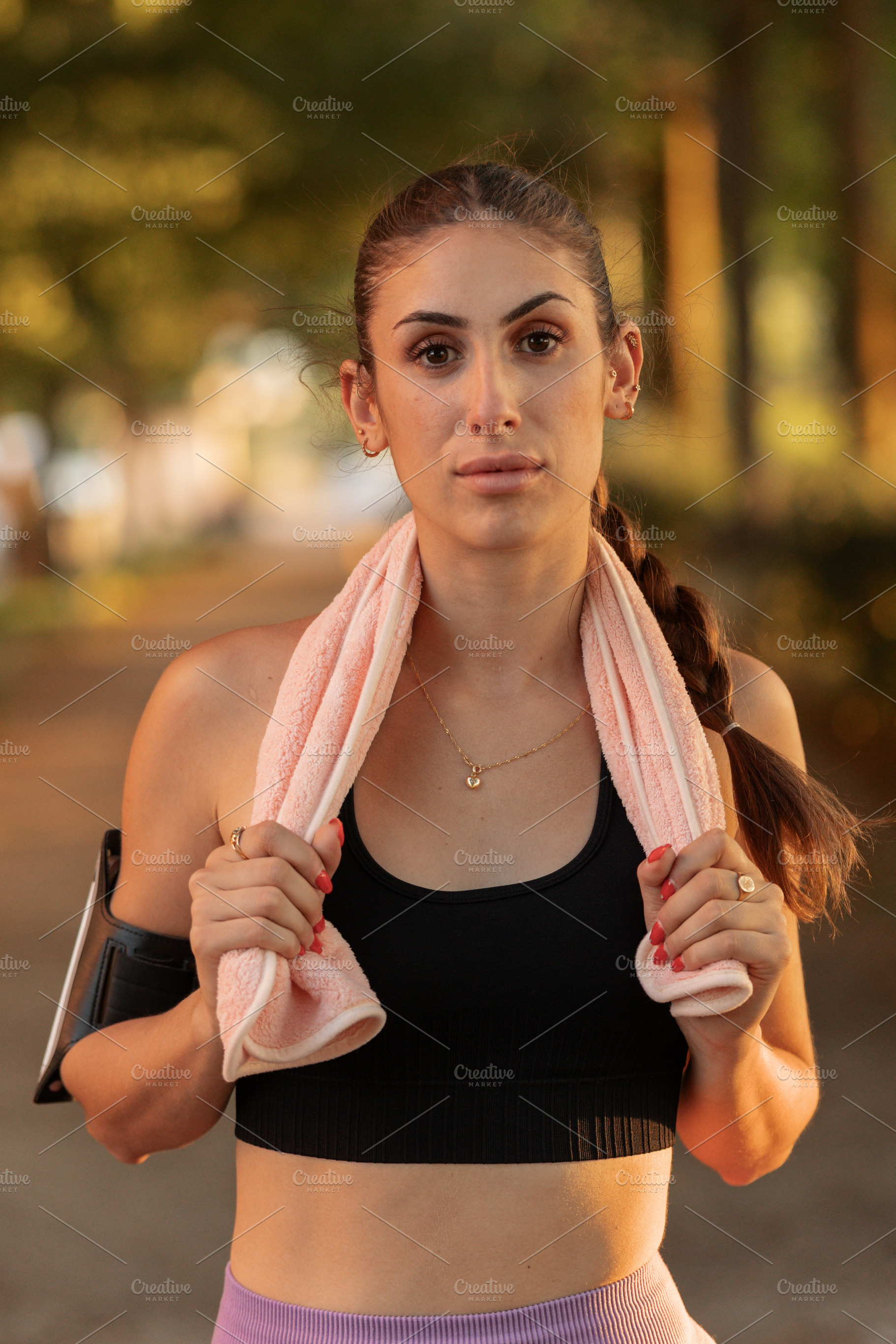 Young woman exercising outdoors at s, a Sports & Recreation Photo by Perpis