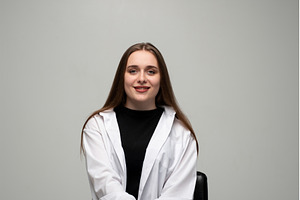 Young woman confidently smiling, a Person Photo by volodymyrshtun13795