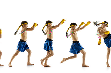 Little boy exercising thai boxing on white background. Fighter practicing, trai, a Sports & Recreation Photo by Volodymyr Melnyk